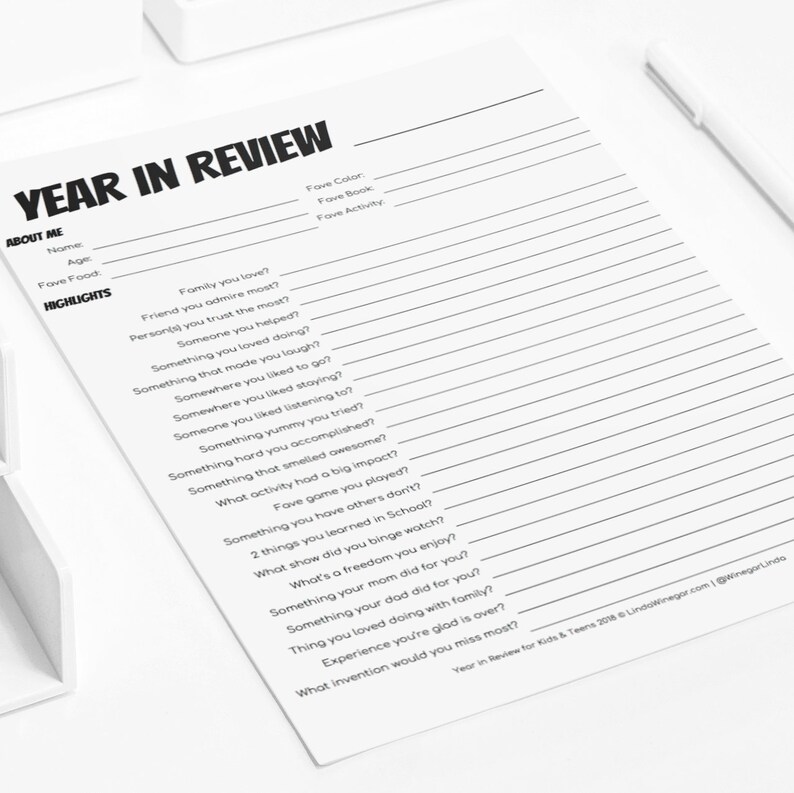 May include: Black and white printable worksheet titled "Year in Review" with questions about the year for kids and teens. The questions include: "Family you love?", "Friend you admire most?", "Person(s) you trust the most?", "Someone you helped?", "Something you loved doing?", "Something that made you laugh?", "Somewhere you liked to go?", "Somewhere you liked staying?", "Someone you liked listening to?", "Something yummy you tried?", "Something hard you accomplished?", "Something that smelled awesome?", "What activity had a big impact?", "Fave game you played?", "Something you have others don't?", "2 things you learned in School?", "What show did you binge watch?", "What's a freedom you enjoy?", "Something your mom did for you?", "Something your dad did for you?", "Thing you loved doing with family?", "Experience you're glad is over?", "What invention would you miss most?"