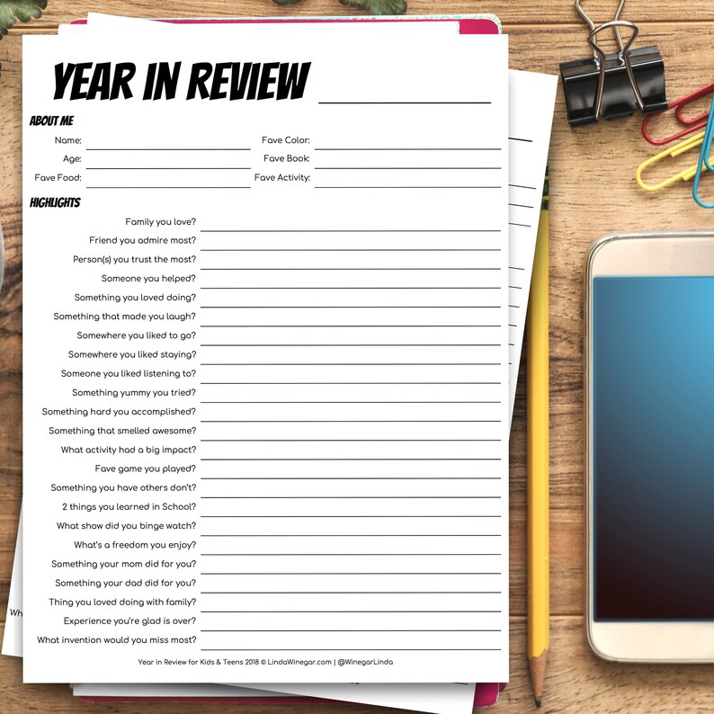 May include: A printable worksheet titled "Year in Review" with prompts for reflecting on the past year. The worksheet includes sections for personal information, such as name, age, and favorite food, as well as prompts for reflecting on highlights of the year, such as favorite family members, friends, and accomplishments.