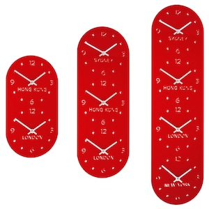 May include: Red oval-shaped wall clock displaying four time zones: Sydney, Hong Kong, London, and New York.