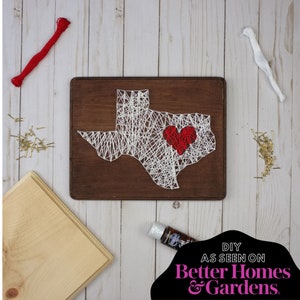 May include: DIY string art project featuring the outline of the state of Texas with a red heart in the center. The project includes a wooden board, string, nails, and a bottle of glue. The text "DIY AS SEEN ON Better Homes & Gardens." is visible in the image.