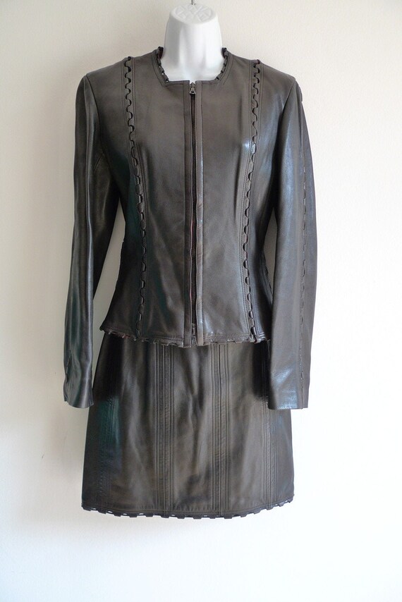 AlaÏa black leather skirt suit with laced panelled