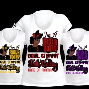 May include: Three white v-neck t-shirts with the text "I'm A Bible Totin' Devil Stompin' Faith Walking Kind of Mama" in various colors. Each shirt features a graphic of a woman with a hat.