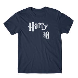 May include: Navy blue t-shirt with white text that reads "Harry 10" with a lightning bolt graphic.