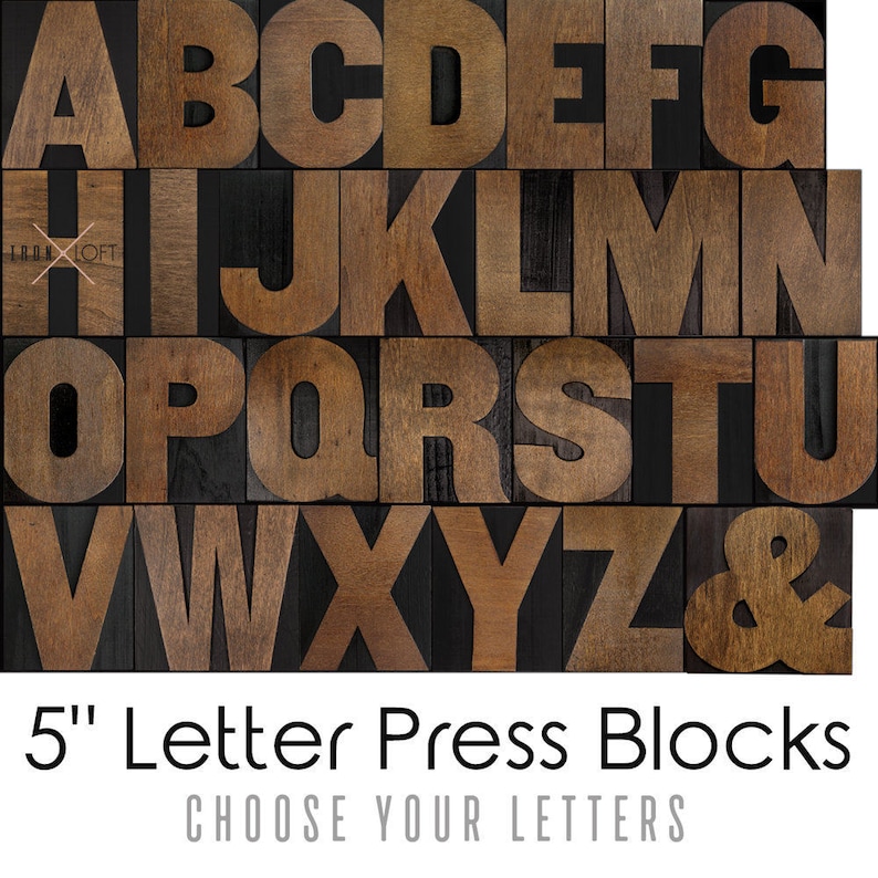 May include: Wooden letterpress blocks in uppercase letters A through Z and an ampersand. The blocks are 5 inches tall and have a dark brown wood finish.  "5" Letter Press Blocks CHOOSE YOUR LETTERS