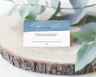 May include: A blue and white diaper raffle ticket with the text "diaper raffle" in white script. The text "Please bring a pack of diapers of any size for a chance to win a special prize" is printed below the title. There is a blank line for a name.