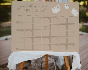 May include: A tan-colored baby shower calendar on a wooden easel. The calendar has a grid for the month of April and May, with the text "guess the arrival of BABY OLIVER." White ghost illustrations are at the top.