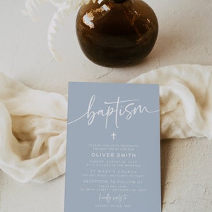 May include: A light blue invitation card with white text announcing a baptism for Oliver Smith. The card features a cross and the word "baptism" in cursive script. The event will take place on Sunday, August 25th at 11:00 AM at St. Mary's Church, followed by a reception at The Plaza Hotel.