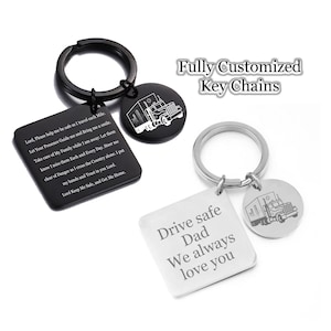 May include: Two silver keychains with a truck design. One keychain has a square tag with the text "Drive safe Dad We always love you". The other keychain has a square tag with a prayer for safe travels.