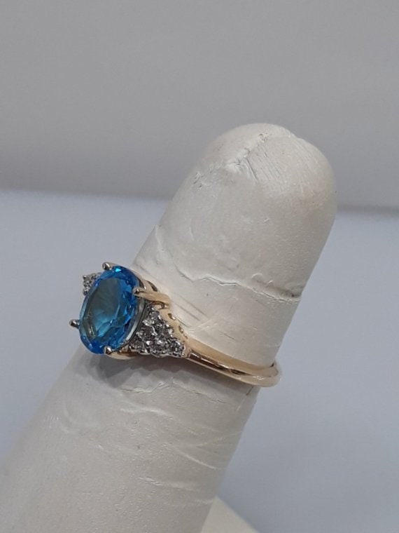 14KT Yellow Gold Oval Blue Topaz And Daimond Ring - image 2