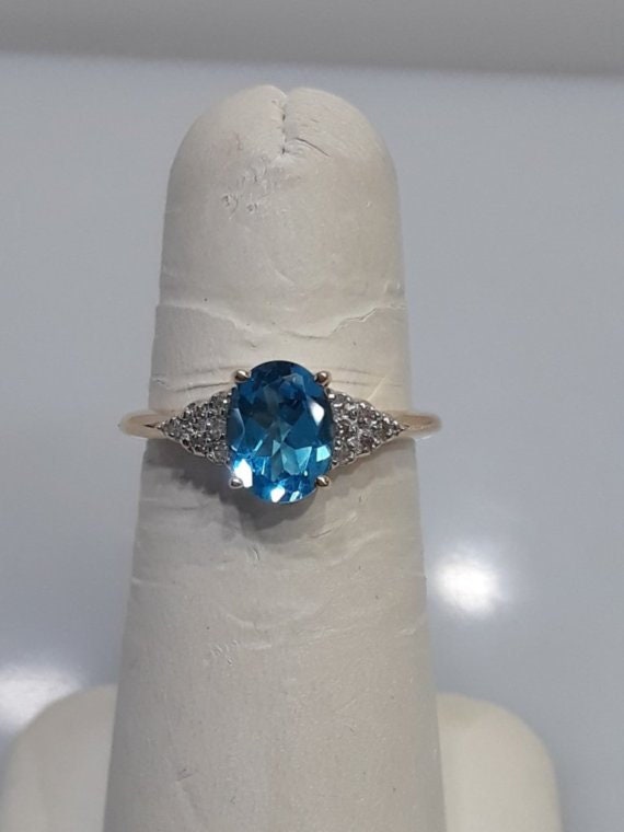 14KT Yellow Gold Oval Blue Topaz And Daimond Ring - image 1