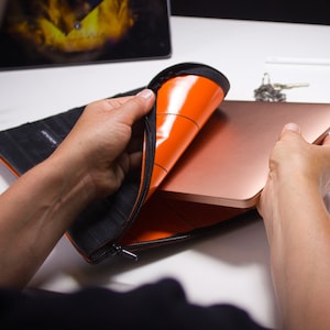 Laptop sleeve made from bicycle tubes orange