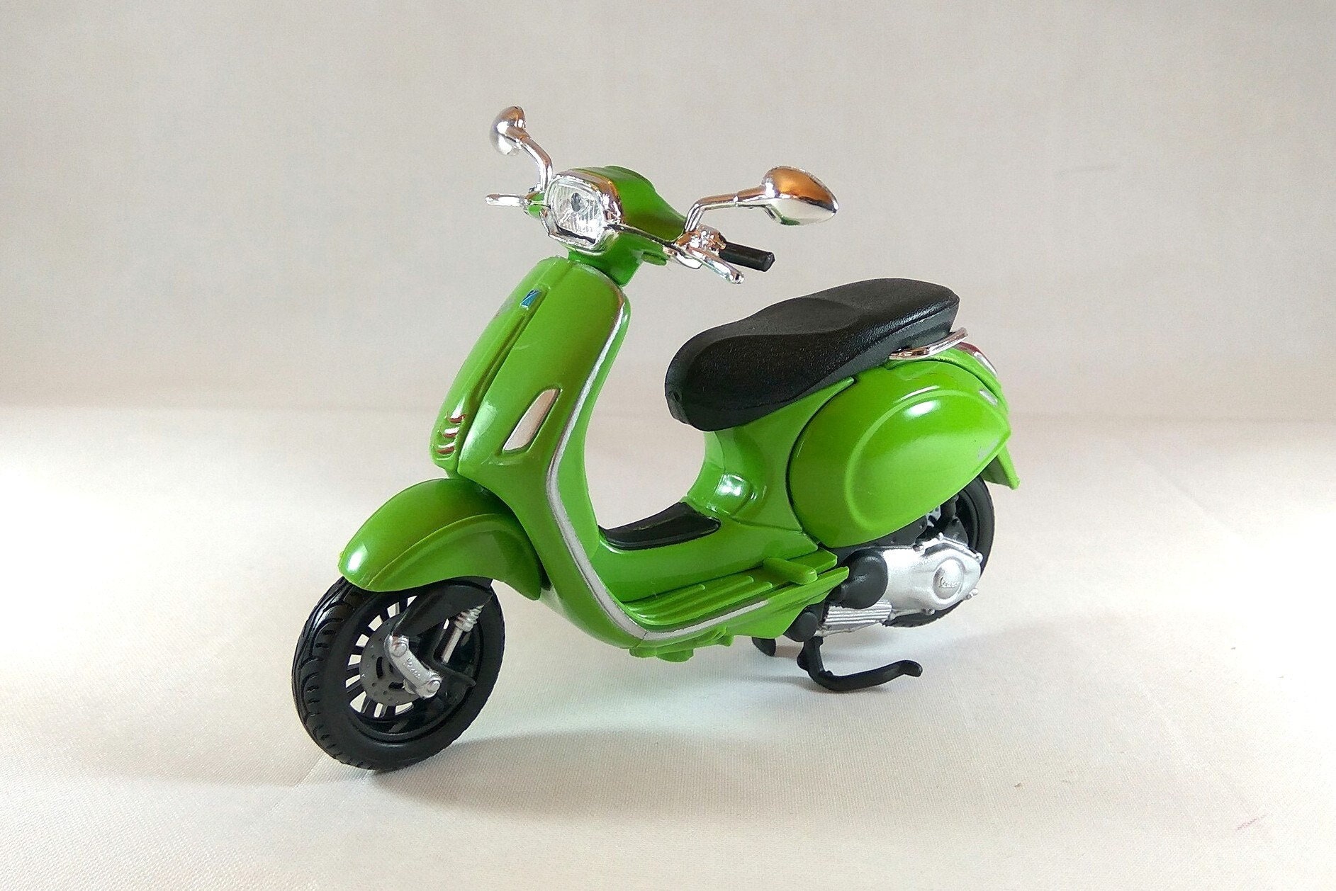 The Unique Vespa S Miniature Made from Wood with White Background