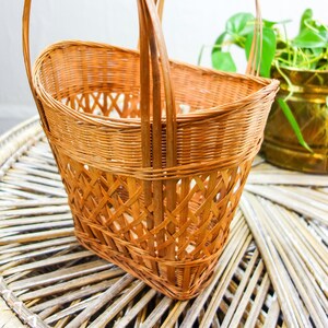 Vintage woven basket with handles 13 x 9.5 thin wicker rattan table top or decorative wall basket farmhouse decor wall hanging image 3