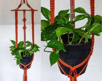 Large macrame plant hanger to hang against a wall in 70s colors rust burnt orange w/ branch, unique hanging planter rust vintage home decor