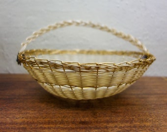 Vintage white and gold 8" woven basket with handle, brass wire and plastic wrapped unique organizer bowl, decorative metal catch all tray