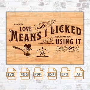 May include: A wooden cutting board with the text "Made with Love Means I Licked the Spoon and Kept Using It". The text is in a brown font and is surrounded by decorative flourishes. The board also features a spoon with a heart on the end and a cloche.