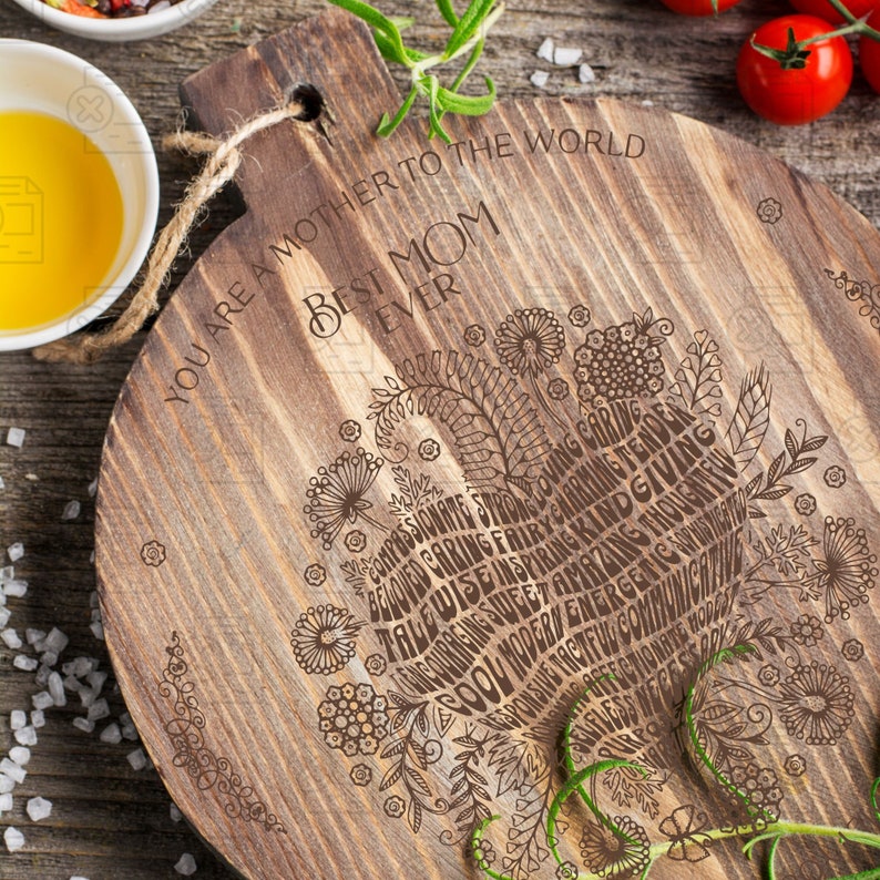 May include: A wooden cutting board with a heart-shaped design made of words describing a mother. The text reads "You are a mother to the world Best Mom Ever".