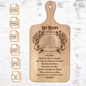 Puede incluir: Tabla de cortar de madera con asa, grabada con las palabras "Life Recipe" y una lista de ingredientes e instrucciones. Los ingredientes incluyen amor, devoción, perdón, esperanza y amabilidad. Las instrucciones también están grabadas.