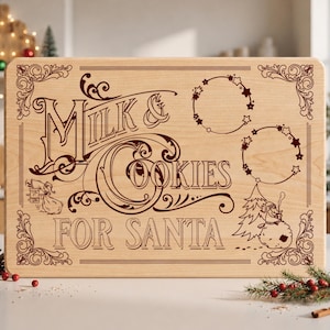 May include: A rectangular light-colored wooden serving board featuring dark brown laser-engraved text that reads Milk & Cookies For Santa. The design includes decorative corner flourishes, two circular star wreaths, a snowman, and Santa on a roof.