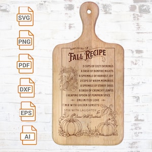 May include: Wooden chopping board with a handle, engraved with a fall recipe. The recipe includes ingredients like cosy evenings, bonfire nights, and pumpkin spice. Features pumpkins and floral accents, ideal for autumn.