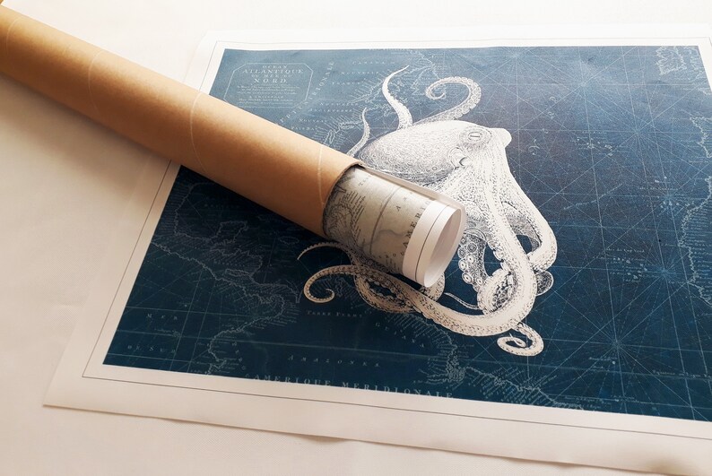 May include: A rolled up nautical map with a vintage illustration of an octopus on a blue background. The map is labeled "Ocean Atlantique du Nord" and "Amerique Meridionale".