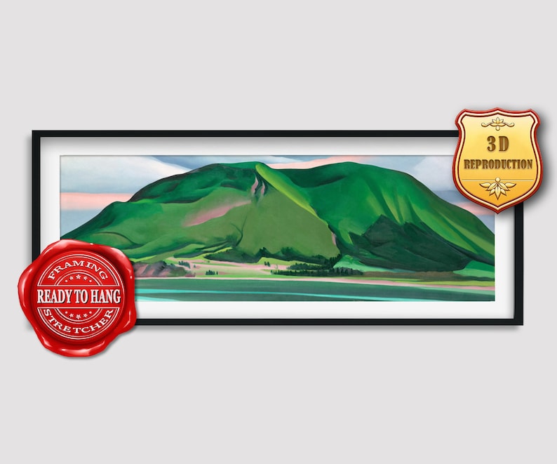 May include: A framed painting of a green mountain with a blue lake in the foreground. The painting is in a black frame and has a red seal that says "Framing & Stretcher Ready to Hang".