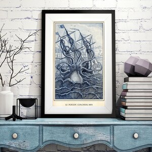 May include: A framed vintage illustration of a giant octopus attacking a ship. The image is in shades of blue and white and has the text "LE POULPE COLOSSAL 1801" at the bottom.