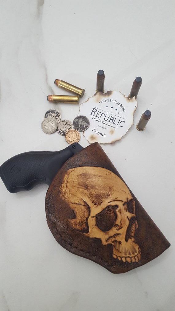 Leather skull Holster for pocket or purse.