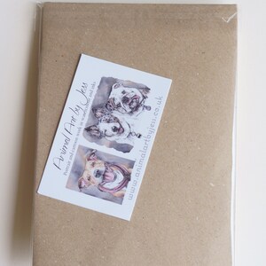 May include: A brown paper envelope with a white business card attached. The business card has a watercolor illustration of three dogs and the text "Animal Art by Jess" and "www.animalartbyjess.co.uk". The envelope has the text "Pack of 5 - back" printed on it.