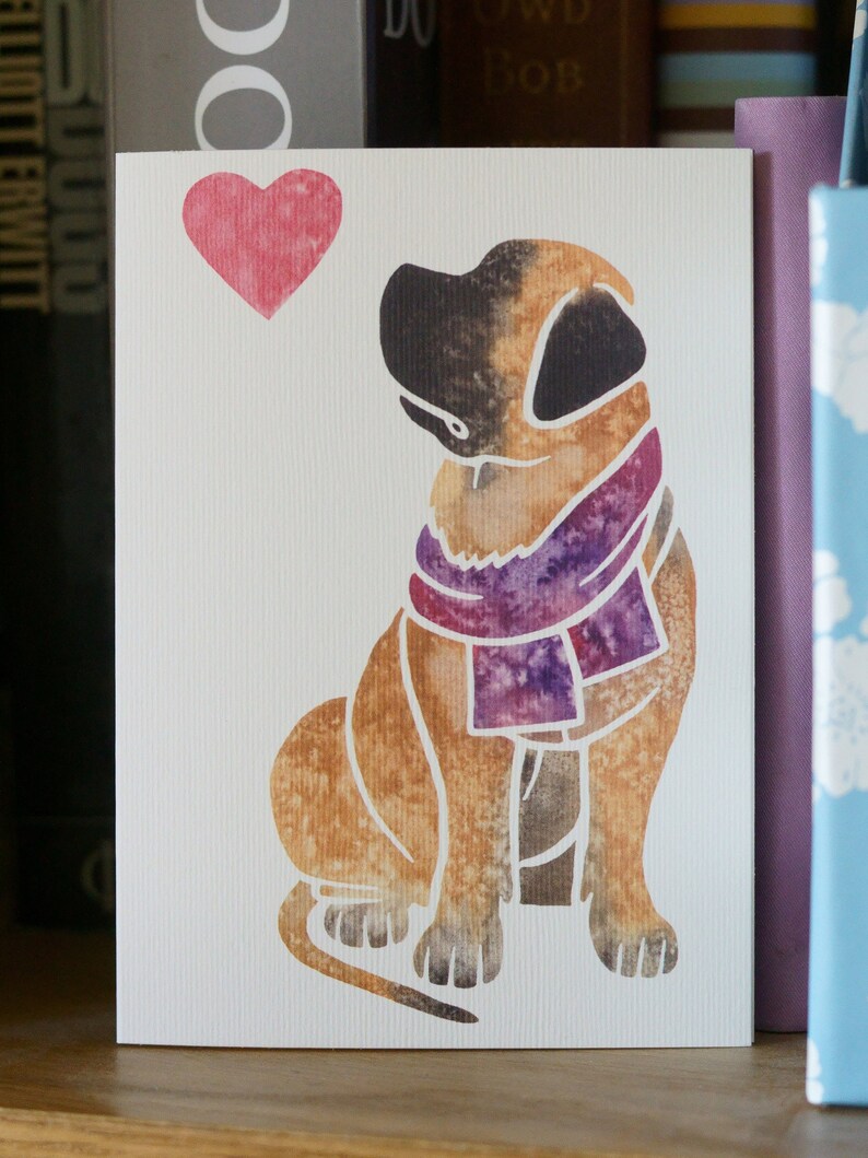May include: A watercolor illustration of a brown dog wearing a purple scarf. The dog is sitting and looking to the left. A pink heart is in the top left corner of the image.