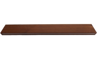 May include: A long, rectangular wooden shelf with a light brown finish. The shelf has a white edge on the top and bottom.
