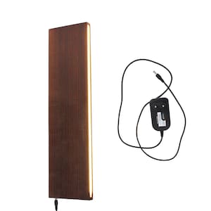 May include: A brown wooden wall sconce with a thin strip of warm white LED light running vertically down the right side. The sconce is wired with a black power cord and a black power adapter.