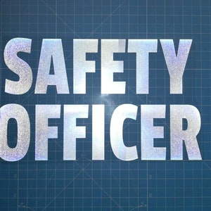 May include: A silver reflective sticker with the text "SAFETY OFFICER" on a blue grid background.