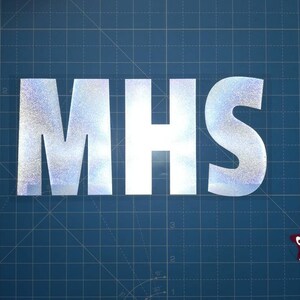 May include: A silver glitter vinyl decal with the letters "MHS" on a blue grid background. A red star is in the lower right corner.