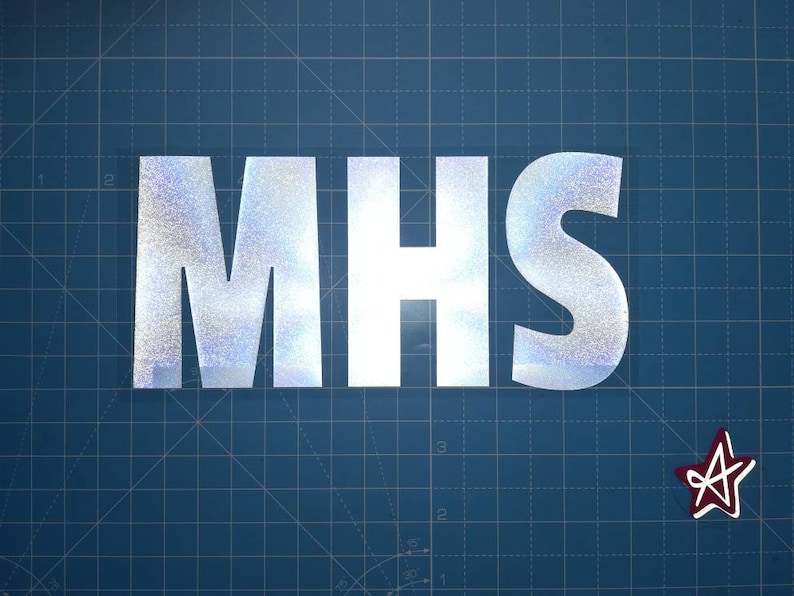 May include: A silver glitter vinyl decal with the letters "MHS" on a blue grid background. A red star is in the lower right corner.