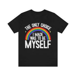 May include: Black t-shirt with a rainbow and the text "The only choice I made was to be myself."