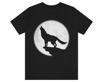 May include: Black t-shirt with a silhouette of a wolf howling at the full moon.