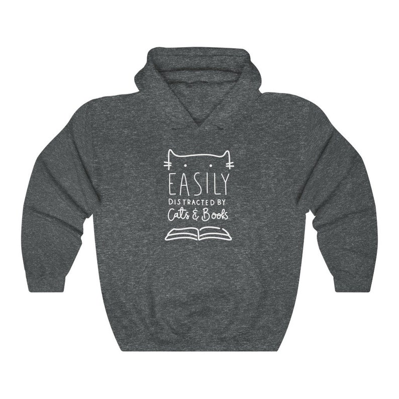 May include: A dark gray hooded sweatshirt with a white outline of a cat and the text "EASILY DISTRACTED BY Cats & Books".