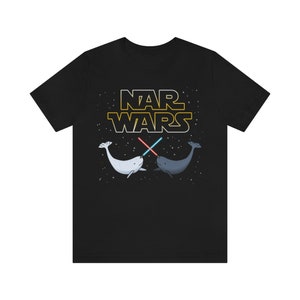 May include: Black t-shirt with a white and gray narwhal graphic and the text "NAR WARS" in yellow.