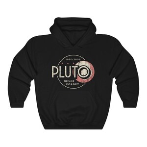 May include: Black hooded sweatshirt with a vintage-style graphic of Pluto, a planet, with the text "1930-2005" and "Pluto Never Forget".