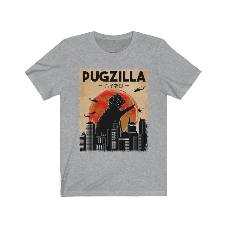 May include: A gray t-shirt with a black and white graphic of a pug standing on a city skyline with the text "Pugzilla -  パグジラ -" above it.