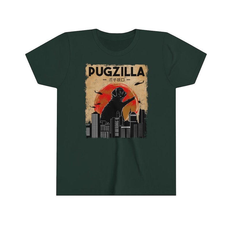 May include: A green t-shirt with a graphic of a pug standing on a city skyline. The graphic is in a retro style with a red sun and helicopters flying overhead. The text "PUGZILLA - パグジラ -" is printed on the graphic.