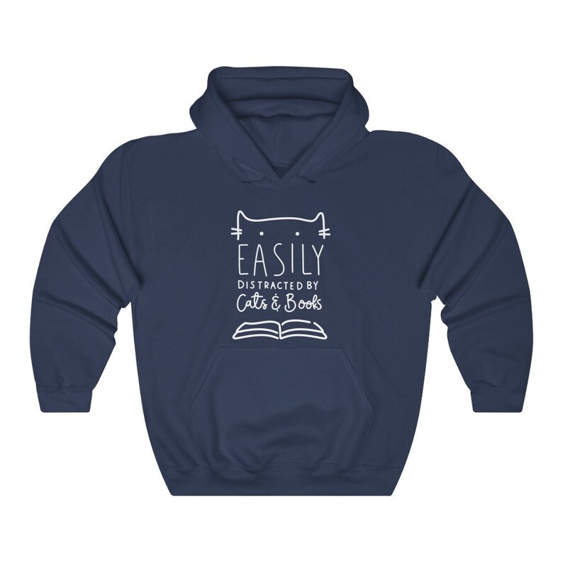 May include: Navy blue hooded sweatshirt with a white graphic design that says "Easily Distracted by Cats & Books" with a cat head and an open book.