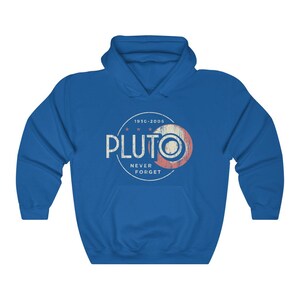 May include: A royal blue hoodie with a distressed, circular graphic that reads "PLUTO 1930-2005 NEVER FORGET" in white text with a red and white star design.