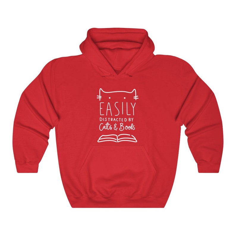 May include: Red hooded sweatshirt with a white graphic design that says "Easily Distracted by Cats & Books" with a cat head and an open book.