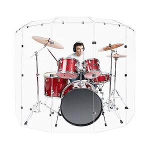 May include: A red drum set inside a clear soundproof enclosure. The drummer is wearing headphones and is playing the drums.