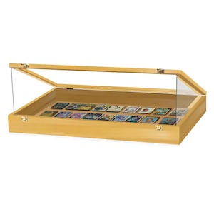 May include: A wooden display case with a glass top and a hinged lid. The case is filled with small, colourful cards.