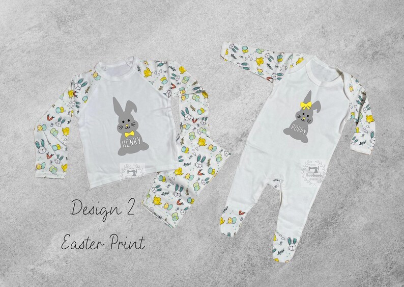 May include: Two white pajamas with an Easter bunny design. One pajama set has a long-sleeved shirt with a bunny and the name "Henry" printed on it. The other pajama set is a one-piece with a bunny and the name "Poppy" printed on it.