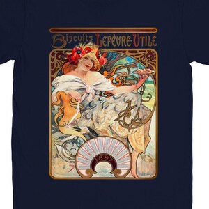May include: A navy blue t-shirt with a vintage illustration of a woman holding a plate of biscuits. The illustration is in a gold frame with the text "Biscuits Lefèvre-Utile" and the year "1893" in the center.