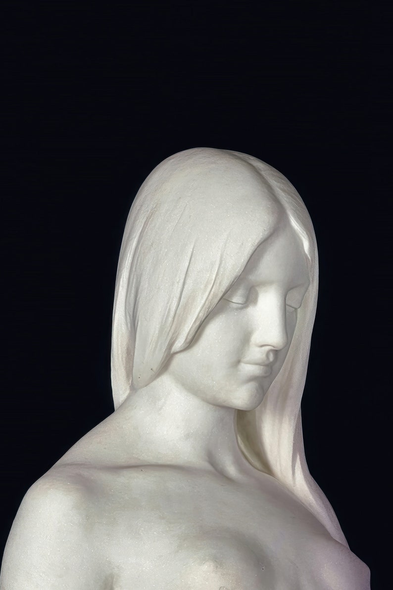 May include: A white marble sculpture of a woman with her head bowed and eyes closed. Her hair is long and flowing, and she is wearing a simple, elegant dress.